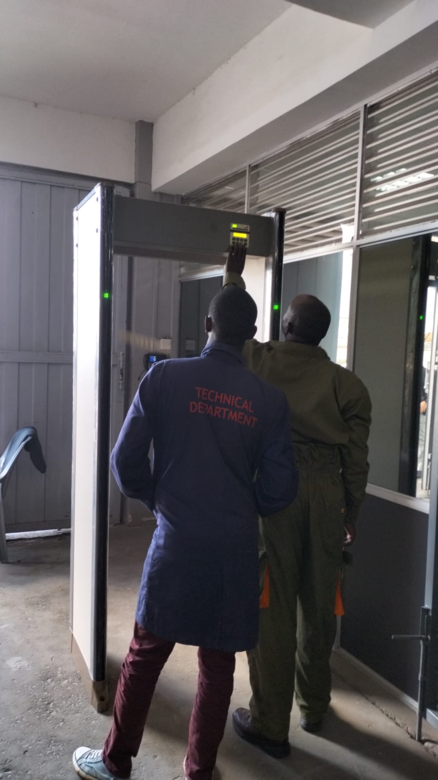 Biosys Kenya technical team installing metal detector