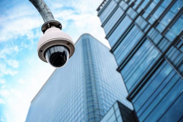 security-camera-with-glass-building-background-1-768x513